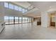 Spacious living room with soaring ceilings, lake views, and an open floor plan at 1600 Pleasant Bay Ct, Henderson, NV 89011