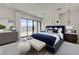 Well-lit main bedroom features a lake view, modern furnishings, and stylish decor at 1600 Pleasant Bay Ct, Henderson, NV 89011