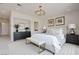 Serene main bedroom features soft colors, luxurious bedding, and ample natural light at 1600 Pleasant Bay Ct, Henderson, NV 89011