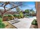 Private backyard with a sparkling pool, spa, and beautiful landscaping at 1725 Cypress Manor Dr, Henderson, NV 89012