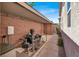 The backyard is complete with a covered area for equipment and an access gate at 1725 Cypress Manor Dr, Henderson, NV 89012