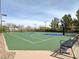 Well-maintained community basketball court surrounded by greenery and fencing, perfect for recreational activities at 1725 Cypress Manor Dr, Henderson, NV 89012