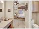Luxurious bathroom featuring a makeup vanity and a deep soaking tub at 1725 Cypress Manor Dr, Henderson, NV 89012