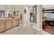 Bright bathroom with a double vanity and a peek into a large walk-in closet at 1725 Cypress Manor Dr, Henderson, NV 89012