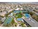 Aerial image showcases tennis courts, a pool, and a basketball court in a community at 1725 Cypress Manor Dr, Henderson, NV 89012