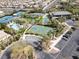 Aerial shot of community amenities featuring tennis courts, pool, and a basketball court at 1725 Cypress Manor Dr, Henderson, NV 89012