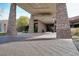 An inviting main entrance showcases stone pillars and elegant stonework, creating a grand and sophisticated arrival experience at 1725 Cypress Manor Dr, Henderson, NV 89012
