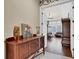 Inviting entryway with wood accents and view to the living room; features elegant decor and neutral walls at 1725 Cypress Manor Dr, Henderson, NV 89012