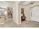 Grand foyer with tile flooring, decorative table, and a chandelier, creating a welcoming entry at 1725 Cypress Manor Dr, Henderson, NV 89012