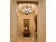 Elegant foyer with gorgeous lighting, stylish decor, and high-end flooring at 1725 Cypress Manor Dr, Henderson, NV 89012
