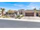 Beautiful single-story home with a desert landscaped yard, a gated front entrance, and a 2-car garage at 1725 Cypress Manor Dr, Henderson, NV 89012