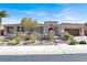 Stunning single-story home featuring a desert landscaped yard, gated entrance and a spacious two car garage at 1725 Cypress Manor Dr, Henderson, NV 89012