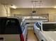Spacious three-car garage with ample parking space for vehicles at 1725 Cypress Manor Dr, Henderson, NV 89012