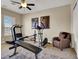 A home gym equipped with fitness equipment and a comfortable chair for relaxation after workouts at 1725 Cypress Manor Dr, Henderson, NV 89012