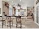Bright kitchen with stainless steel appliances, breakfast bar, and a seamless flow into the dining area at 1725 Cypress Manor Dr, Henderson, NV 89012
