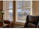 Bright home office featuring plantation shutters, modern decor, and ample natural light at 1725 Cypress Manor Dr, Henderson, NV 89012
