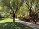 Beautiful park featuring walking paths, mature trees, and seating areas, creating a serene outdoor environment at 1725 Cypress Manor Dr, Henderson, NV 89012
