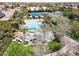 A refreshing pool area with lounge chairs and cabanas, offering a perfect spot for relaxation and recreation in the community at 1725 Cypress Manor Dr, Henderson, NV 89012