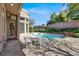 Inviting backyard featuring a pool, spa, and patio area for entertaining guests at 1725 Cypress Manor Dr, Henderson, NV 89012