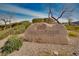 Stone sign with 'Dragon Ridge Country Club' emblem, surrounded by desert landscaping at 1725 Cypress Manor Dr, Henderson, NV 89012