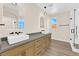 Elegant bathroom with dual vessel sinks, modern fixtures, and sleek walk-in shower at 177 Rocky Star St, Henderson, NV 89012