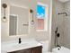 Contemporary bathroom featuring stylish fixtures, tiled shower and modern vanity at 177 Rocky Star St, Henderson, NV 89012