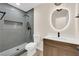 Modern bathroom with tiled shower, toilet, and sleek vanity at 177 Rocky Star St, Henderson, NV 89012