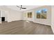 Sun-drenched bedroom has wood-look floors and several windows providing ample light and views at 177 Rocky Star St, Henderson, NV 89012