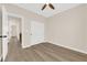 The bedroom has wood-look flooring, a closet with sliding doors, and views to other rooms at 177 Rocky Star St, Henderson, NV 89012