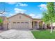 Beautiful single-story home with a well-maintained lawn, two-car garage, and attractive architectural details at 177 Rocky Star St, Henderson, NV 89012