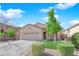 Inviting single-Gathering home with a well-maintained lawn, mature landscaping, and a three-car garage at 177 Rocky Star St, Henderson, NV 89012