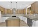 Modern kitchen featuring stainless steel appliances, white cabinets, and pendant lighting at 177 Rocky Star St, Henderson, NV 89012