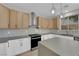 Updated kitchen featuring modern appliances, stylish lighting, and sleek countertops at 177 Rocky Star St, Henderson, NV 89012