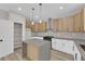 Updated kitchen with island and stylish pendant lighting, offering ample cabinet and counter space at 177 Rocky Star St, Henderson, NV 89012