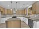 Well-equipped kitchen with stainless steel appliances, central island, and plenty of natural light at 177 Rocky Star St, Henderson, NV 89012