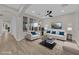 Bright, staged living room with ample natural light and modern furnishings for a cozy atmosphere at 177 Rocky Star St, Henderson, NV 89012