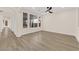 Spacious living room with luxury vinyl flooring and arched doorways bathed in bright light at 177 Rocky Star St, Henderson, NV 89012