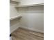 Spacious walk-in closet with ample shelving and hardwood floors at 177 Rocky Star St, Henderson, NV 89012