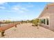 Spacious backyard with desert landscaping and views of the surrounding area at 2069 Colvin Run Dr, Henderson, NV 89052