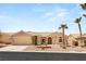 Single-story home with desert landscaping, two palm trees, and a two-car garage at 2069 Colvin Run Dr, Henderson, NV 89052