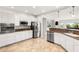 Spacious kitchen with white cabinetry and stainless steel appliances at 2069 Colvin Run Dr, Henderson, NV 89052
