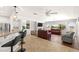 Open-concept space with a bar, fireplace, and backyard views at 2069 Colvin Run Dr, Henderson, NV 89052