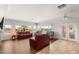Bright living room with recessed lighting, large windows, and contemporary furnishings at 2069 Colvin Run Dr, Henderson, NV 89052