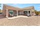 Charming covered patio with stone pavers, perfect for outdoor entertaining and relaxing at 2069 Colvin Run Dr, Henderson, NV 89052