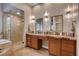 Bathroom with double sinks, walk-in shower, and soaking tub at 2074 Sutton Way, Henderson, NV 89074