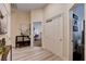 Hallway with light wood floors, white trim, leading to a bedroom or office with view of decor and furnishings at 2074 Sutton Way, Henderson, NV 89074