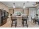 Modern kitchen features a stylish island with bar seating, stainless steel appliances, and bright, updated countertops at 2074 Sutton Way, Henderson, NV 89074