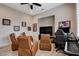 This living room features comfortable seating and a dedicated entertainment area at 2074 Sutton Way, Henderson, NV 89074