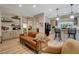 Cozy living room seamlessly connected to a modern kitchen, ideal for entertaining and relaxed living at 2074 Sutton Way, Henderson, NV 89074