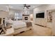 Spacious main bedroom with a fireplace and ceiling fan at 2074 Sutton Way, Henderson, NV 89074